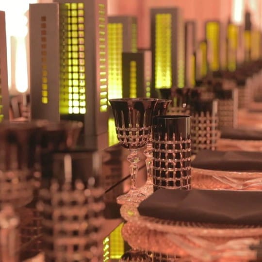 Bespoke 50ft New York skyline table runner, and custom gold platform benches for models designed and built by Event Concept to showcase the latest range from Stuart Weitzman for his London's Regent Terrace project